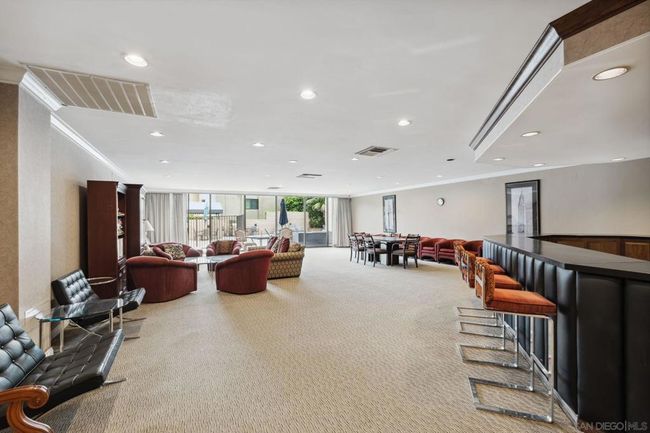 Common area recreation room with bar and kitchen | Image 39