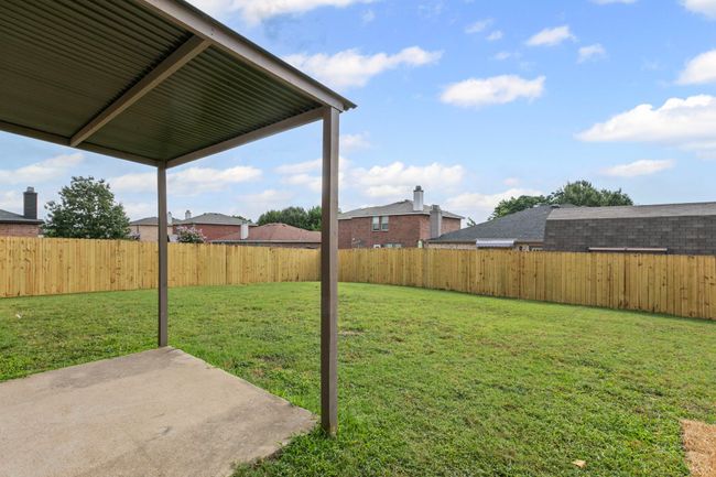 Fenced backyard featuring a patio | Image 23
