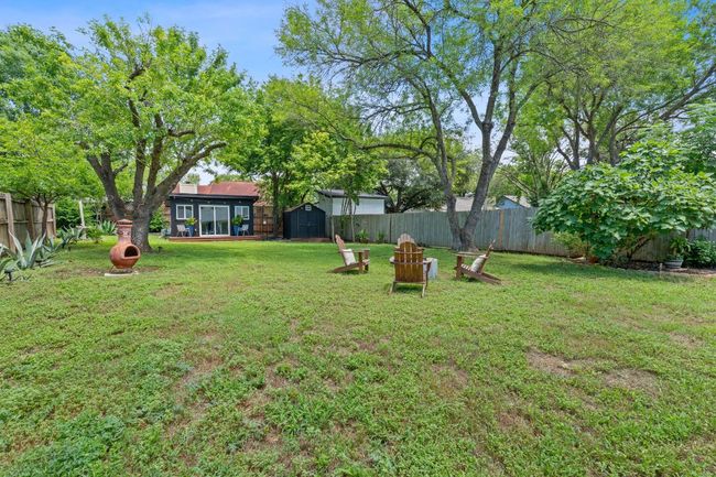 View of yard with a storage unit | Image 34