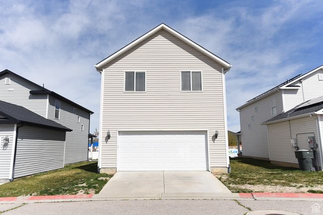 View of front of house with concrete driveway and a garage | Image 32