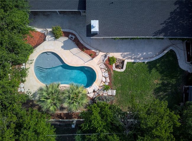 Aerial view of property and surrounding area with a pool area | Image 32