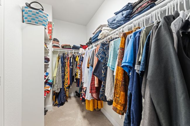 Walk in closet featuring carpet floors | Image 26