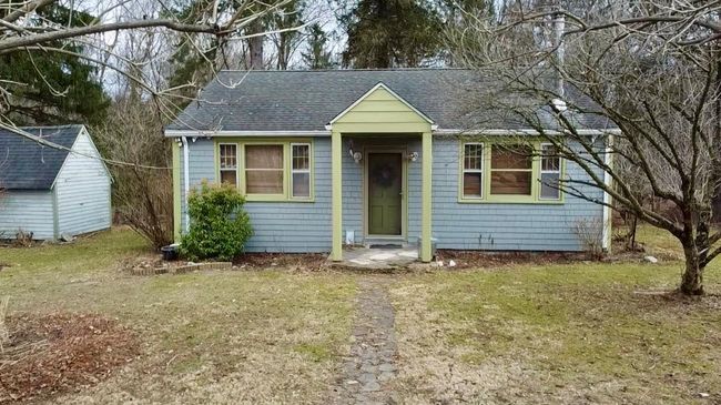 View of front of property featuring an outbuilding and roof with shingles | Image 4