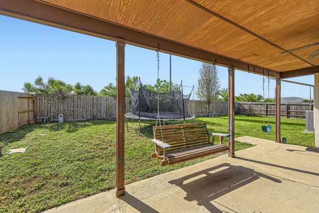 Covered Back Porch In The Large Fully Fenced Backyard | Image 26