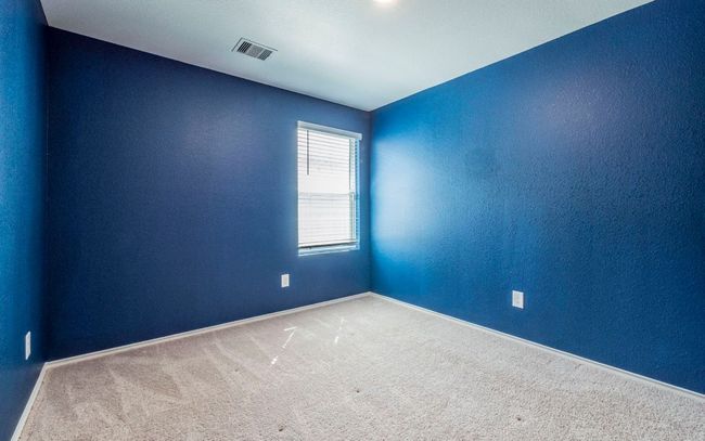 Carpeted spare room featuring a textured wall | Image 16