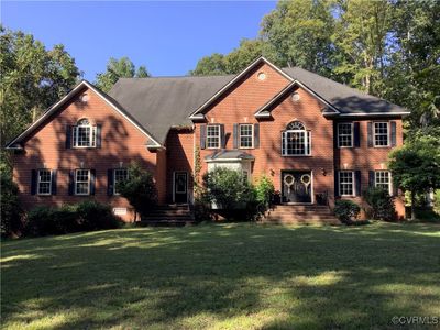 Colonial home with a front lawn | Image 1