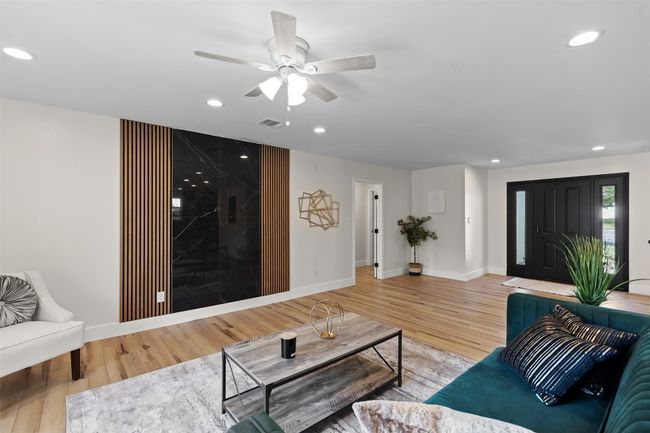 Living area featuring recessed lighting, wood finished floors, baseboards, and ceiling fan | Image 6