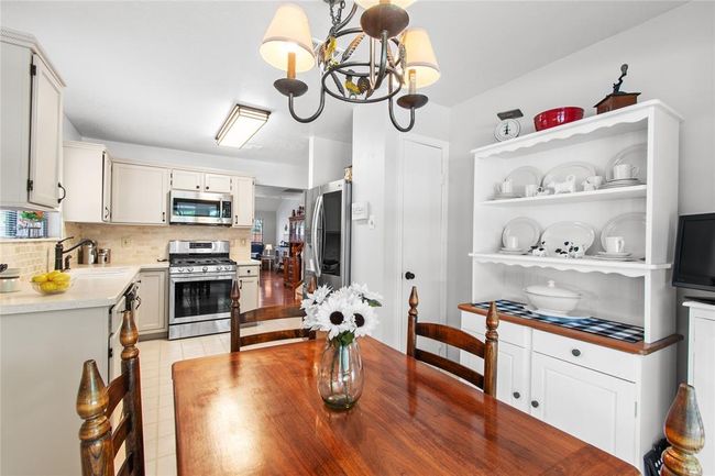 Beautifully updated and neutral kitchen with a pantry. | Image 9