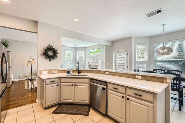 Kitchen with breakfast bar and bay window dining space | Image 9