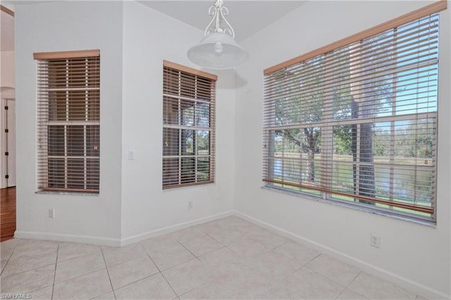 Tiled spare room featuring a healthy amount of sunlight | Image 30
