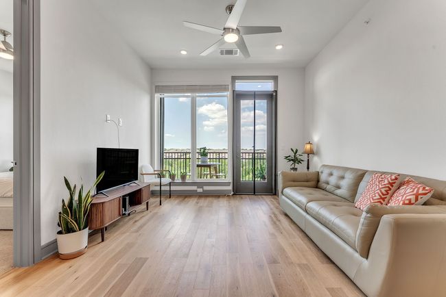 Living room featuring light wood-style floors, a ceiling fan, and recessed lighting | Image 7