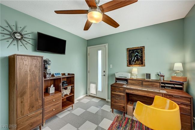 Office featuring light floors, baseboards, and a ceiling fan | Image 32