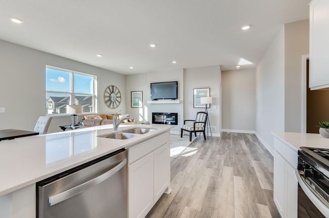 Open floor plan let's the conversation flow. Photo is of a previously built model home, finishes and selections will vary. | Image 6