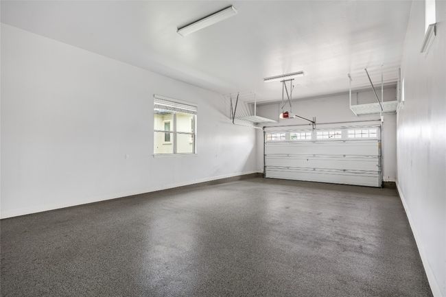 Garage with baseboards | Image 32