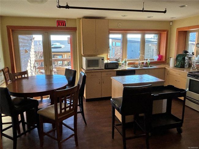 Shared Kitchen featuring white microwave, stainless steel electric stove, light countertops, and recessed lighting | Image 34
