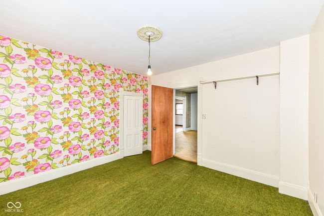 Bedroom 2 (reverse angle) shows closet and entry | Image 10