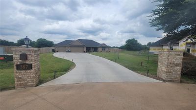 View of front of house with a garage and a front yard | Image 1