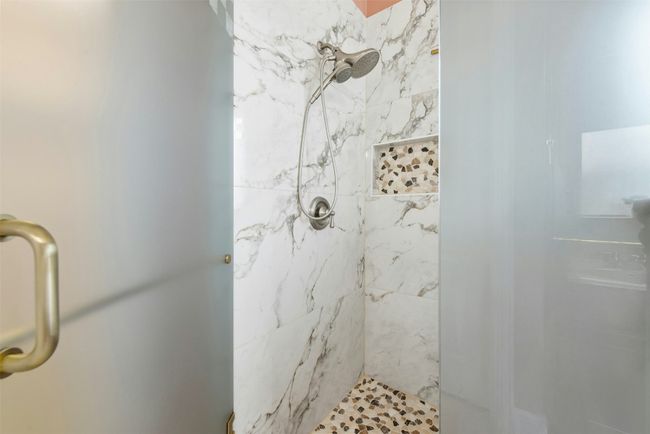 The shower was recently updated in the last year with beautiful tile detail. | Image 14