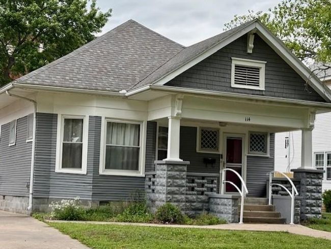 View of front of property with covered porch and a shingled roof | Image 30