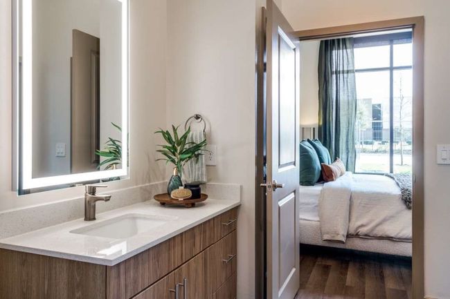Bathroom featuring hardwood / wood-style flooring and vanity | Image 12