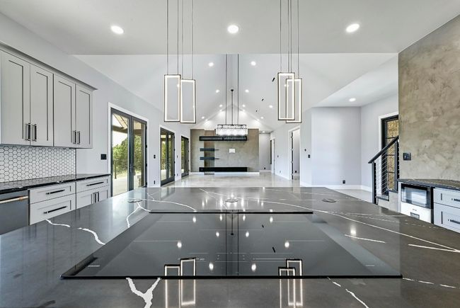 The island features a Samsung 36" smart induction cooktop with Wifi. | Image 16