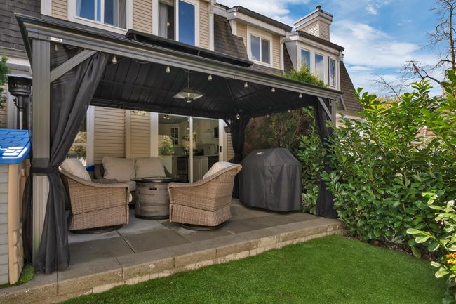 View of patio / terrace with grilling area and outdoor lounge area | Image 22