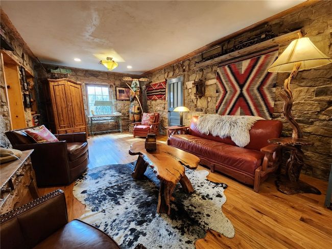 Living room with wood finished floors | Image 10
