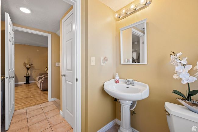 Bathroom with tile patterned floors and toilet | Image 32