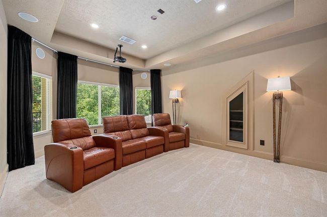 Media room is located upstairs. Furniture, projection screen, and other AV equipment will convey with the home. | Image 29