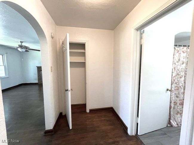 Hall featuring arched walkways, wood finished floors | Image 15