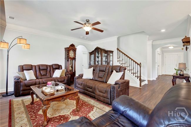 View of Great Room looking towards foyer and stairway to second level with large loft area. 4 bedrooms and 2 full bathrooms | Image 22