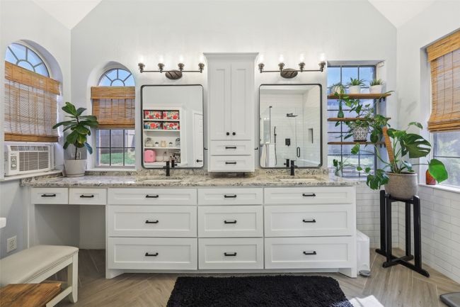 Updated primary bathroom with beautiful woven blinds to accent the natural light. | Image 21