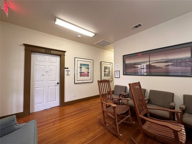 Office featuring wood finished floors and baseboards | Image 10