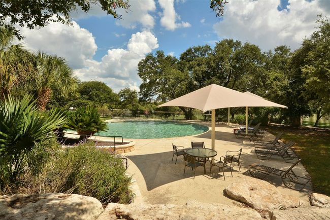 Pool featuring fence and a patio area | Image 32