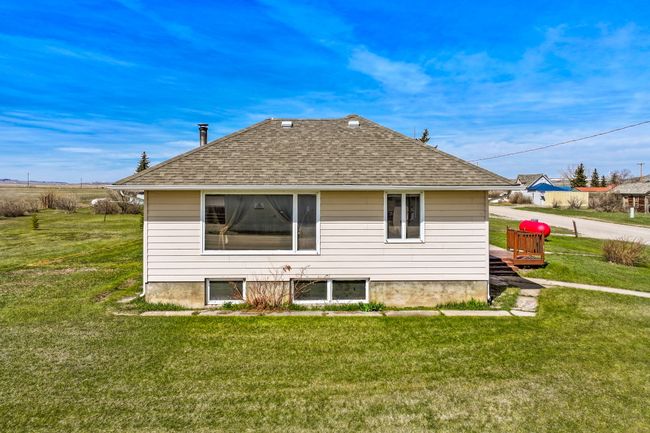 Back of property with a yard and roof with shingles | Image 7