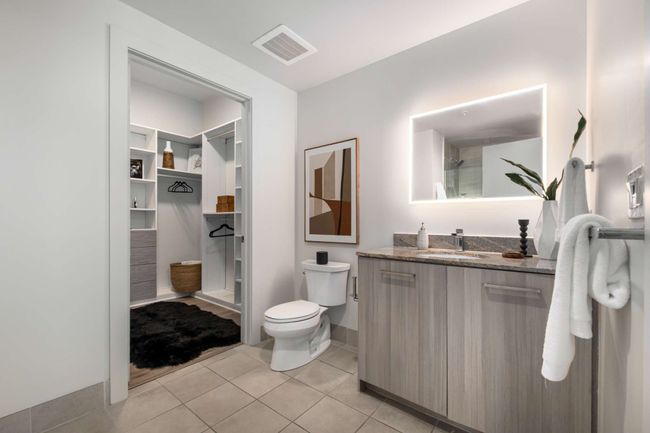 The ensuite bathroom leads directly into the generous primary closet, making getting ready for the day a pleasure. | Image 28