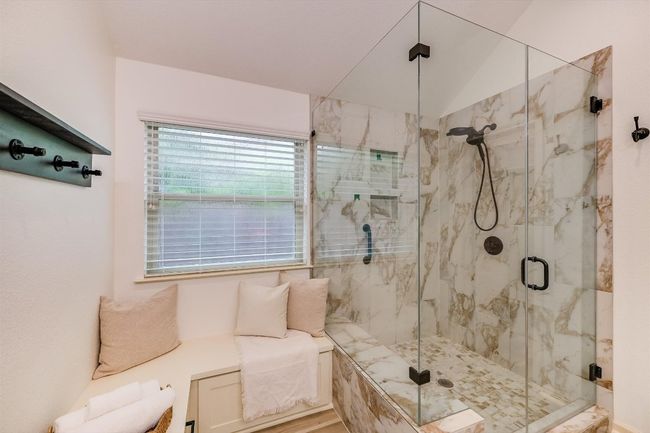 Bathroom featuring a marble finish shower | Image 26