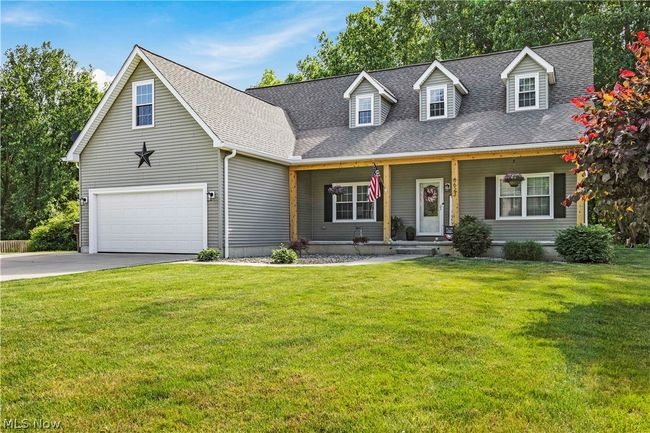 New england style home with a front yard | Image 50