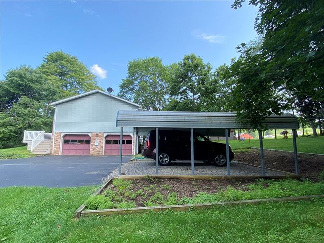 Side View- 2 Car Garage plus 2 Vehicle Carport | Image 18