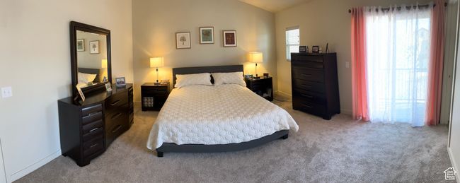 Bedroom featuring light carpet and lofted ceiling | Image 29