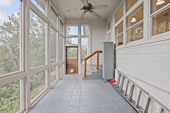 The screen porch is a great spot to enjoy your morning coffee without the mosquitos. | Image 33