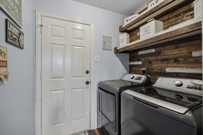 Laundry just off the garage | Image 25