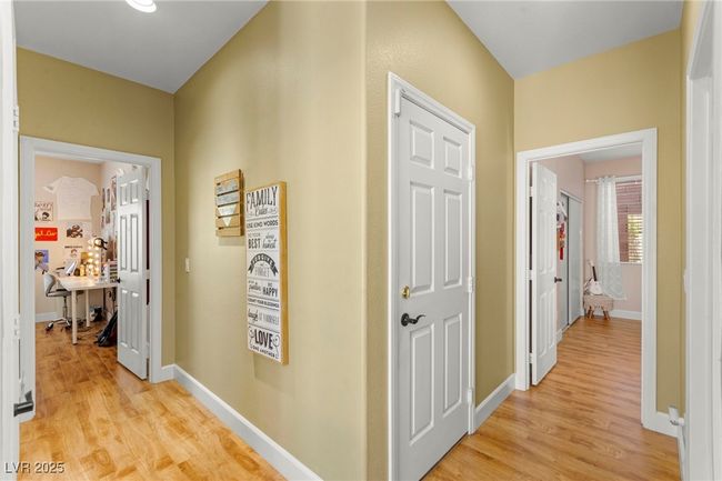 Hall with light wood finished floors and baseboards | Image 32