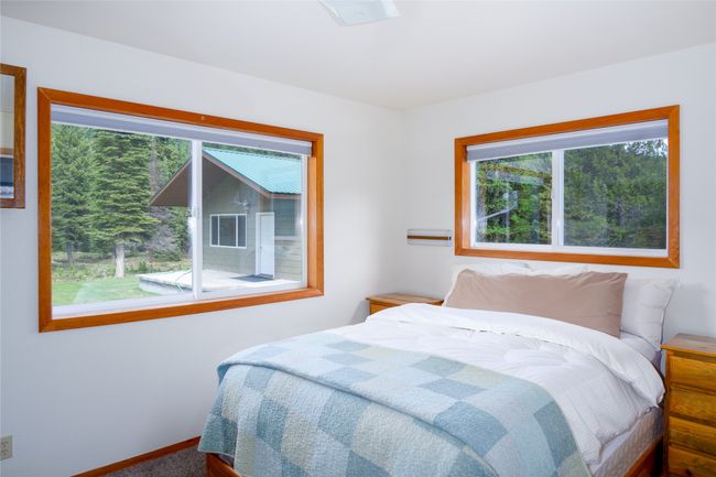 Carpeted bedroom featuring baseboards | Image 90