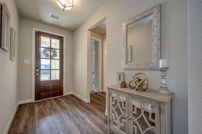 Beautiful expansive foyer with Jack and Jill secondary rooms to the left of entering. | Image 3