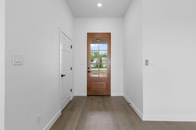 Doorway to outside with recessed lighting, baseboards, and dark wood finished floors | Image 7