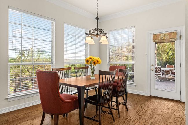 Breakfast area with off of the kitchen and open to the den. Two doors leading to the backyard and two covered patios. | Image 16