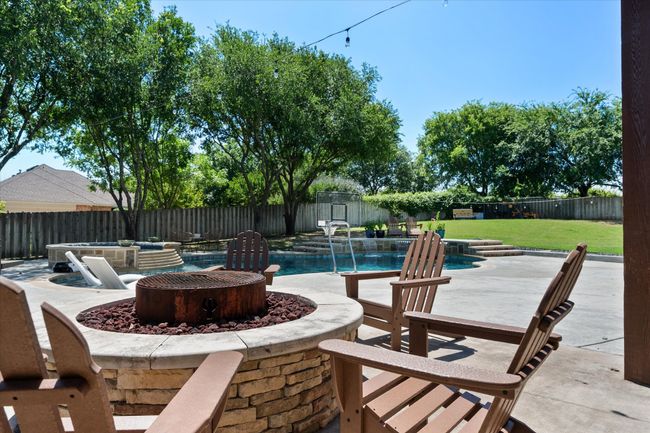 View of patio featuring a fire pit | Image 26