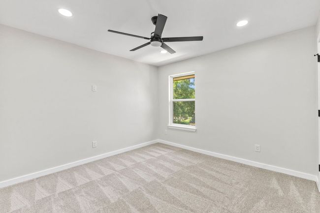 2nd bedroom with new carpet, paint, ceiling fan & lighting | Image 23