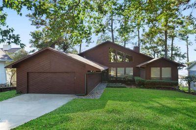 Beautiful modern style Lake Conroe waterfront home in the neighborhood of Cape Malibu. | Image 1